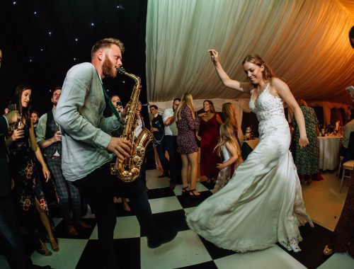 Saxophonist and Bride having a dance off