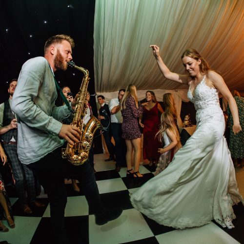 Saxophonist for DJ Sax package dancing with the bride