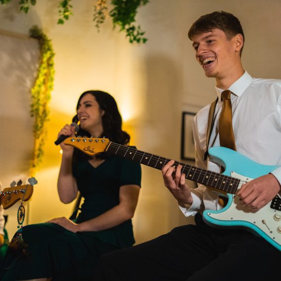 wedding function band sits with instruments ready to perform for guests. Wedding band performs for all events, such as weddings, corporate parties and christmas parties.